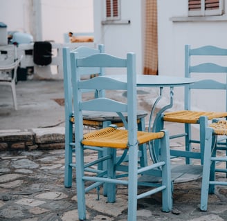 a table with chairs and chairs and a dog