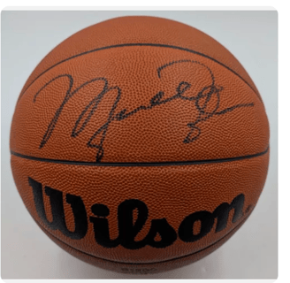 a michael jordan basketball ball with a signed signed basketball ball