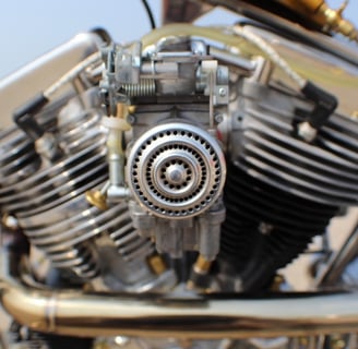 a motorcycle with a hand-built engine in the background