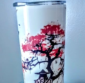 A white stainless steel tumbler featuring a traditional samurai under a cherry blossom tree 