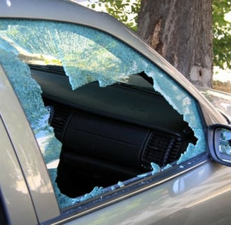 a car with a broken windshield and a broken windshield