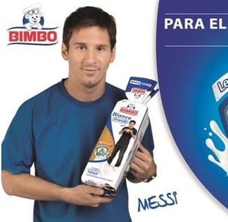 a man holding a box of cereals and milk