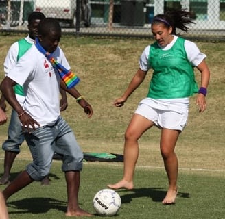 Dr. Sam Van Gorder playing barefoot soccer with local students in Egypt during Semester at Sea.