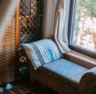 Cozy room with sofa near window by Charlotte May from Pexels