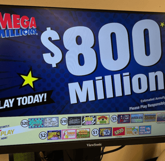 a large screen tv with a large screen showing a $ 800 million winning mega millions