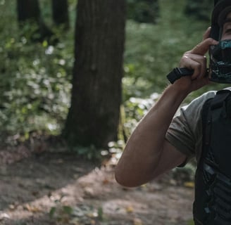 a man in a helmet and a camera taking a picture of a bike