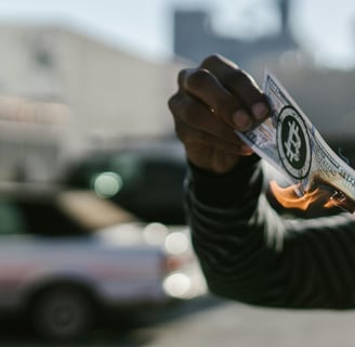 man holding money on fire