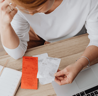 business-women-stressing-over-receipts-and-bookeeping