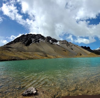 a lake with a mountain in the background
