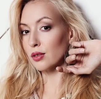 A Woman Adorning Handmade Jewelry