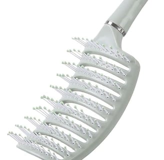 a brush brush with a white comb and a white comb