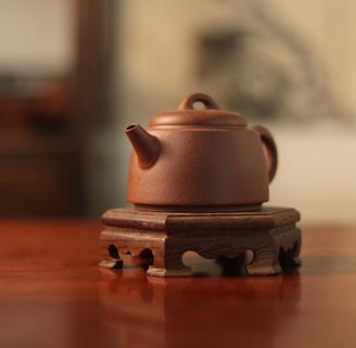 Brown teapot placed on a wooden stand