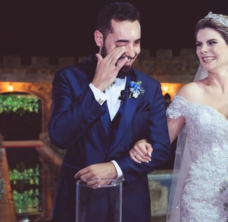 a bride and groom are standing in front of a wedding ceremony