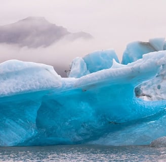 Anchorage, AK -A broken Iceberg floating in the lake at Portage Glacier