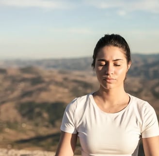 a woman sitting in a yoga pose