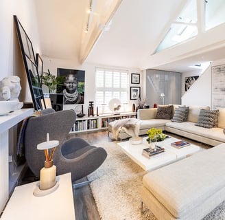 a living room with a couch and a fireplace