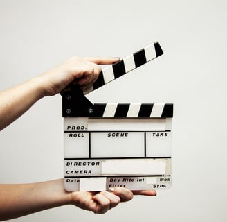 a person holding a clapper board 