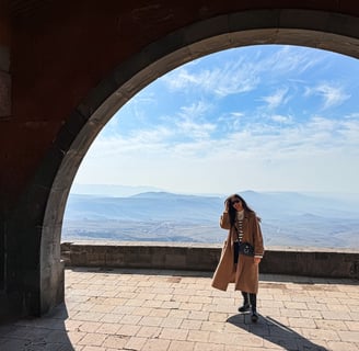 woman standing in charent's arch