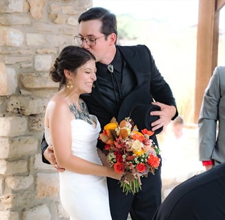 a man and woman standing in altar