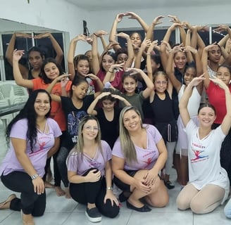 a group of people standing in front of a mirror