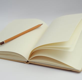 a pencil and pencil on a notebook with a pencil and pencil