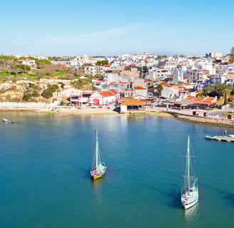 View of Alvor village with its marina filled with boats