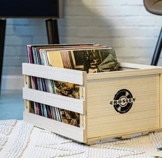 a wooden crate with a record player's record album