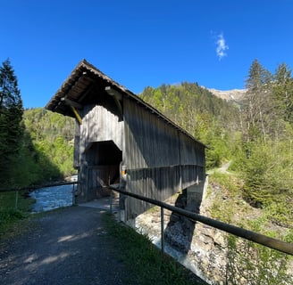 A covered bridge over the Entschlige River outside of Frutigen