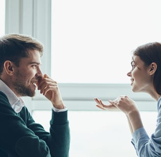 a man and woman sharing a meal at a restaurant