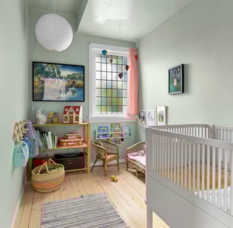 a baby's room with a crib and a crib