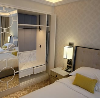 a bedroom with a bed and a mirror