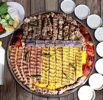 a pizza with meat and vegetables on a table