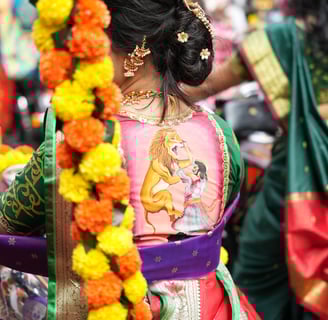woman in maharastrian traditional outfit riding a motorbike in girgaon gudipadwa shobhayatra 2025