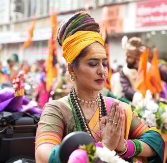woman with dreadlocks hair riding a motorbike in girgaon gudipadwa shobhayatra 2025