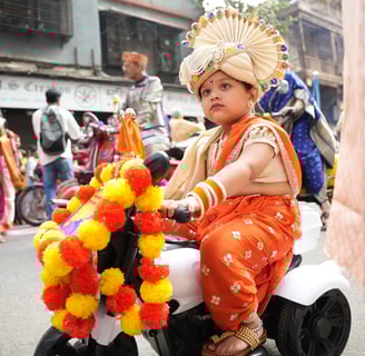 girl kid in maharastrian traditional outfit riding a motorbike in girgaon gudipadwa shobhayatra 2025