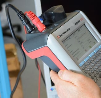 a man is holding a handheld computer