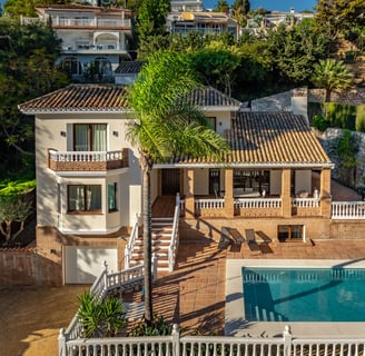 a house with a pool and a pool in the foreground