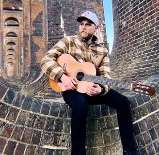 a man with a guitar and a guitar