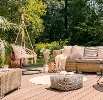 a patio with a couch and a chair