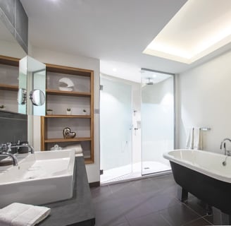 a bathroom with a bathtub and a shower