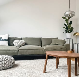 a living room with a couch and a table