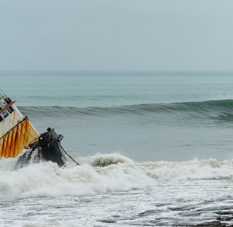 shipwreck with wave about to roll on the back