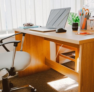 White Rolling Armchair Beside Table by Lisa Fotios From Pexels