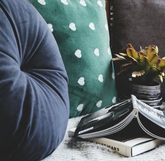 Throw Pillows Beside Books by Krisztina Papp from Pexels