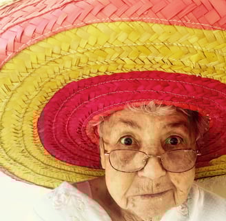 elderly woman with a colorful hat