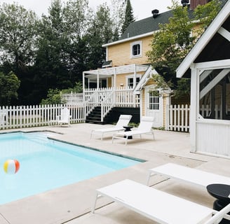 a pool with a beach ball in the middle of the pool