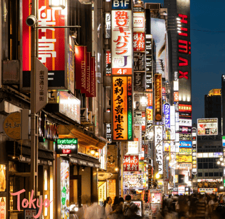 a busy street with many signs in Tokyo