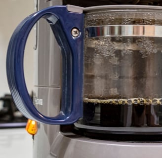 a coffee maker with a coffee potted in a coffee pot