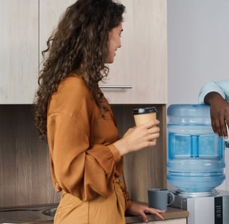 a man and woman standing in a kitchen