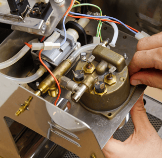 a person is working on a machine that is being worked on